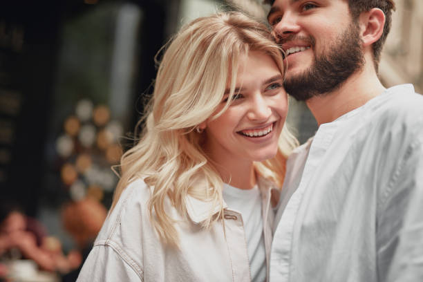 istock Romantic couple is hugging outdoors and smiling 1163045024