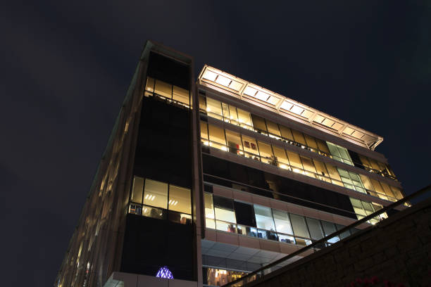 istock view at night of a modern glass office building 1163047780