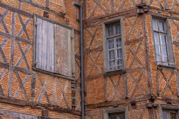 Lautrec (Tarn, Midi-Pyrenees, France), medieval village with half-timbered buildings: window with flowers