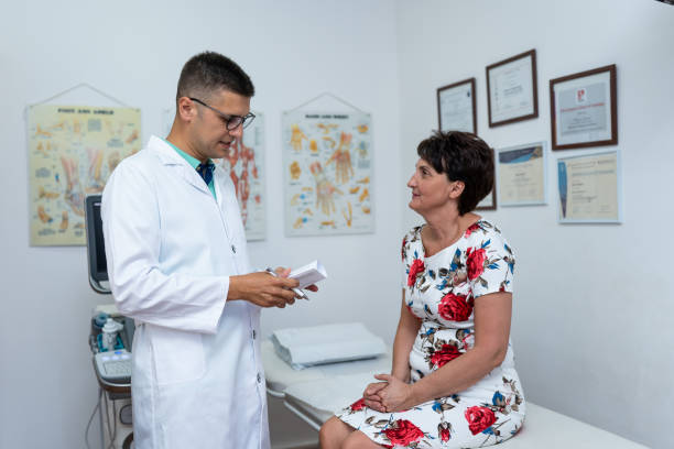 istock Senior woman at the doctor 1163054105