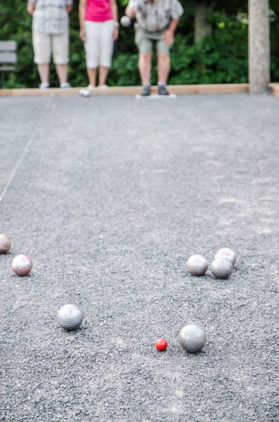 istock Elderly playing petanque outside 1163054114