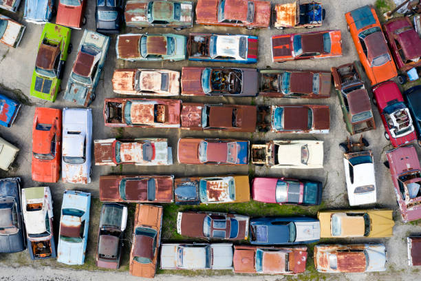 Aerial view a large group of old American cars on a junkyard.