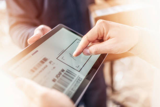 Customer signing receipt of home delivery on a tablet