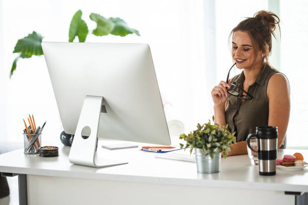 istock Happy woman working at home 1163060548