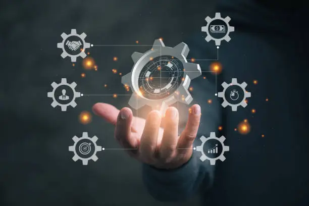 Business process management and workflow automation diagram with gears and icons with connection line network in background. Manager touching interface