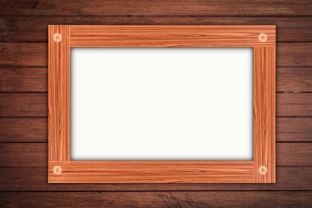 istock Empty wooden frame, hanging on wood panels background. Retro style design 1163066258
