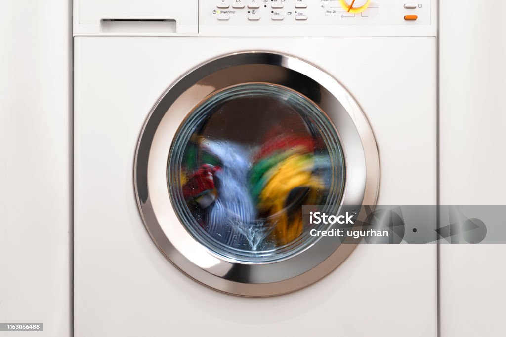 Washing machine with laundry Washing Machine Stock Photo