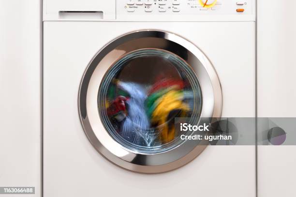Washing Machine With Laundry Stock Photo - Download Image Now - Washing Machine, Spinning, Front View