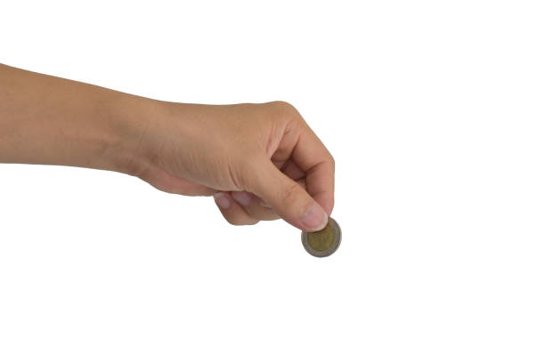 istock Saving money concept. Hand putting coin isolated on white background with clipping path 1163070339