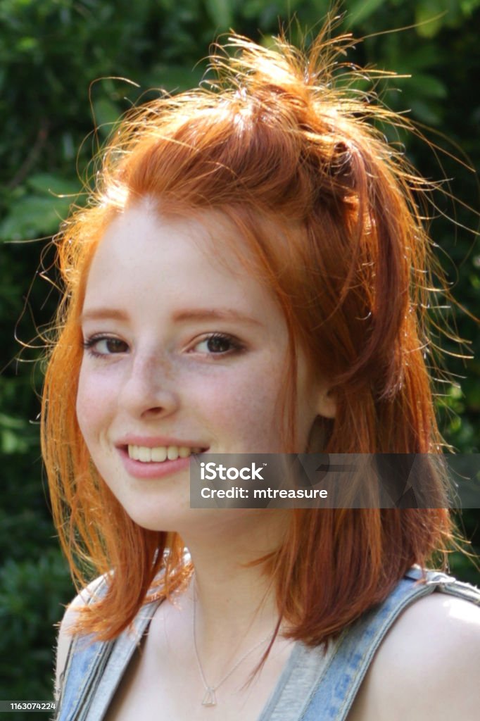 Image Of Young Pretty Teenager Redhead Girl Face Profile With Red Hair Long  Bob Hairstyle Looking Happy With Ginger Hair In Sunshine And Freckles On  Pale Skin Standing In Garden With Denim