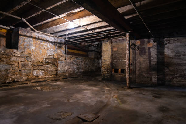 Interior old warehouse basement Interior of old grungy warehouse basement. basement stock pictures, royalty-free photos & images