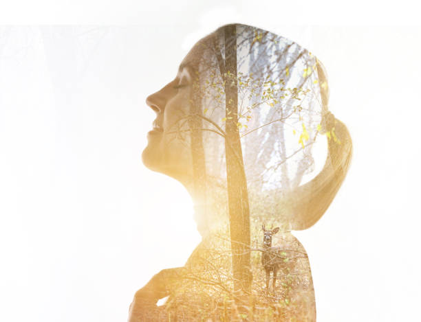 istock Multiple exposure of a young woman, forest and deer. 1163079913