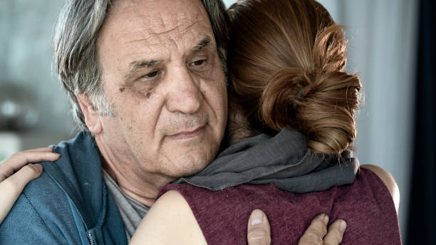 istock Father and daughter hugging close up view 1163082362