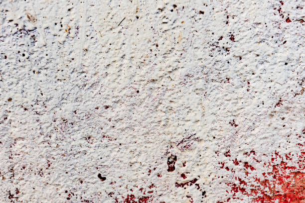 istock Texture of a concrete wall with cracks and scratches which can be used as a background 1163084725