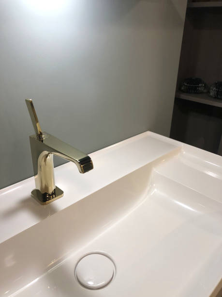istock Image of luxury bathroom suite with floor tiles, white ceramic rectangular sink, washroom with stainless steel Victorian mixer tap, tiled floor flooring 1163085661