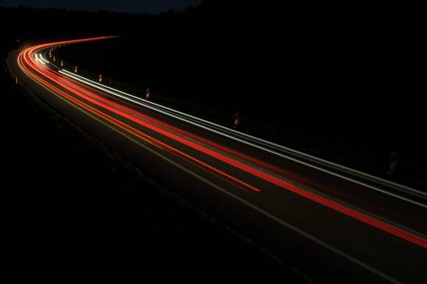 istock lights of cars with night 1163087685