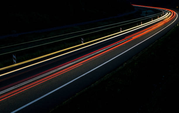 istock lights of cars with night 1163087854