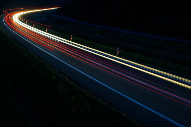 istock lights of cars with night 1163087861