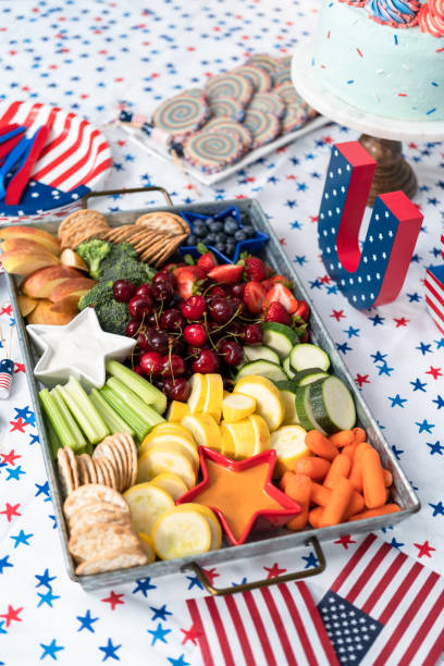 istock Snack tray with fresh fruits, vegetables, and dips 1163088816