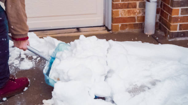 istock Young man shoveling snow from driveway. 1163088836