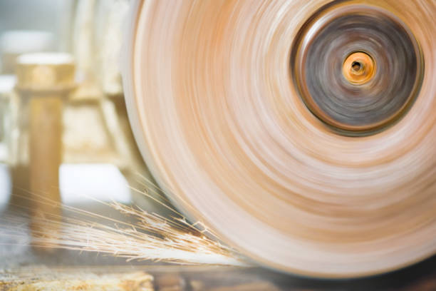 istock Close-up of rotating grinding machine disc. Rotating disc grinding machine with sparks. A machine for turning a round shape. Grinder. 1163090576