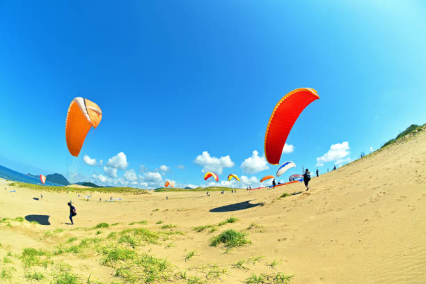 istock Paqagliding at Tottori sand dunes 1163091500