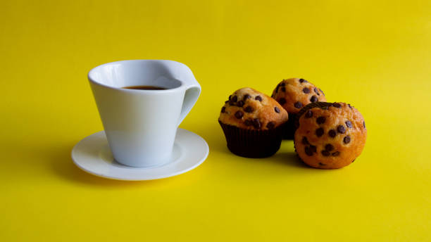 istock break with a coffee and a cupcake, delicious. 1163093338
