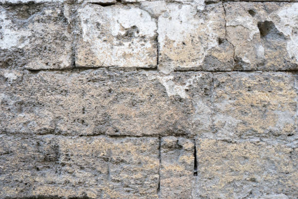 istock Abstract brick wall background with scuffs and cracks 1163094224