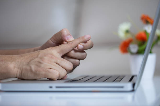 istock Man holding her wrist pain from using computer. Office syndrome 1163095151