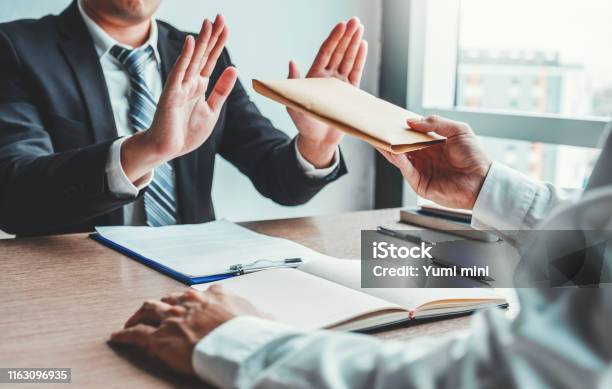 Corruption And Briberybusinessman Manager Refusing Receive Money From Business Man Passing Money Dollar Bills To Deal Contract Stock Photo - Download Image Now