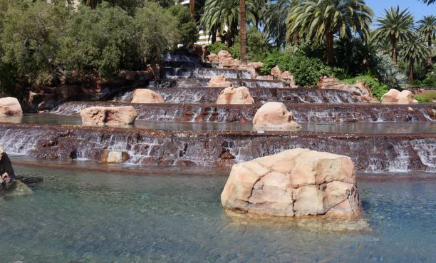 istock Waterfalls in a landscaped garden 1163097115