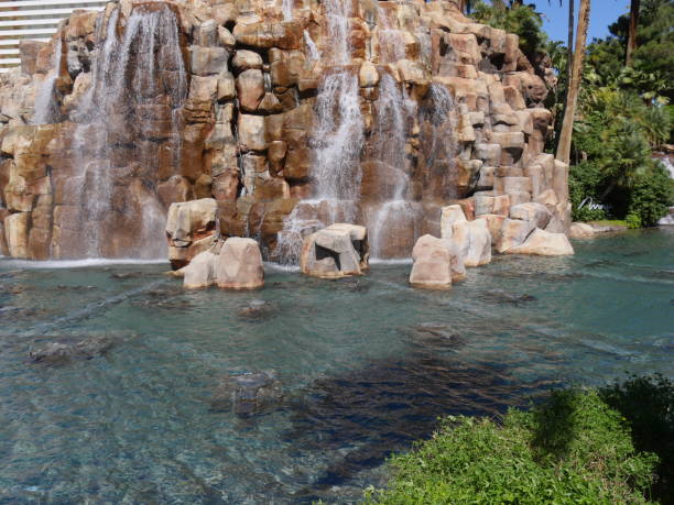 istock Waterfalls in a landscaped garden 1163097148