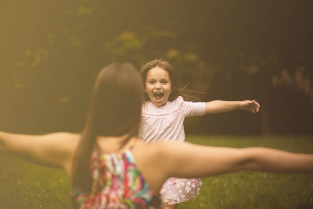 She want to give her the biggest hug. Mother and daughter in nature.