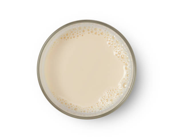 istock Cup with soy milk bubble foam top view 1163100620