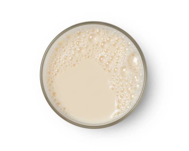 istock Cup with soy milk bubble foam top view 1163100959