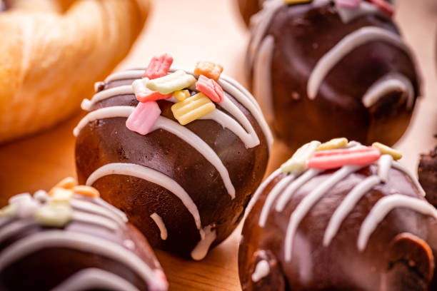 chocolate ball with topping and brownies on wooden background