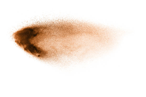 istock Abstract  brown color sand splash on white background. Brown dust particles explosion on background, throwing freeze stop motion concept. 1163105455