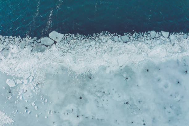 glacier lagoon with icebergs from above. aerial view. cracked ice from drone view. background texture concept. - cold frozen sea landscape imagens e fotografias de stock