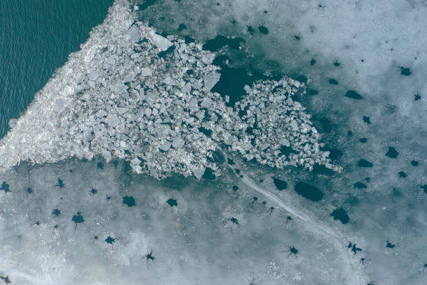 istock Glacier Lagoon with icebergs from above. Aerial View. Cracked Ice from drone view. Background texture concept. 1163105651