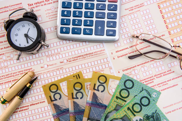 istock Australian tax declaration as background for calculator and dollars 1163106915