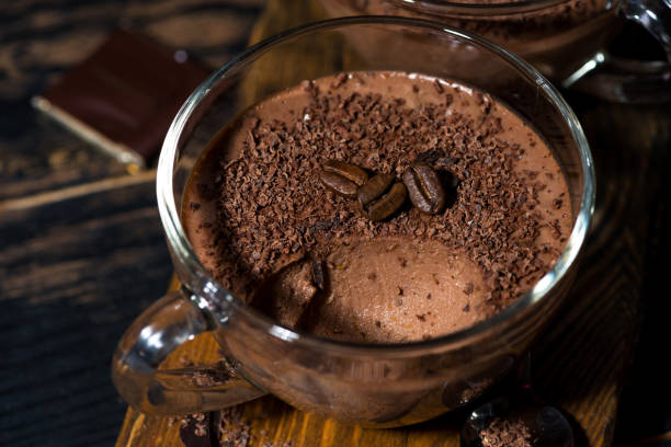 istock sweet chocolate mousse in glass cup, closeup 1163108355