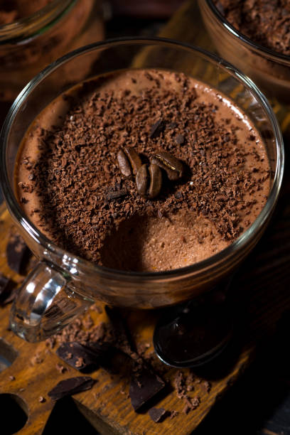 istock sweet chocolate mousse in glass cup, vertical closeup 1163108483
