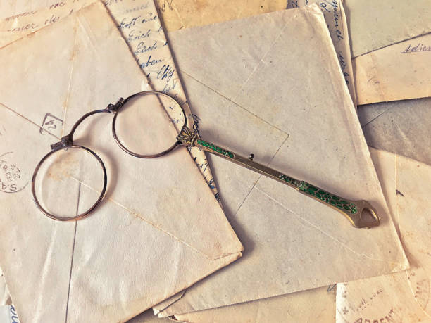 istock Vintage eyeglasses over old letters 1163108840
