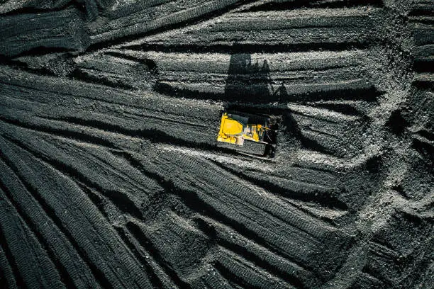 Photo of Open pit mine. Aerial view of extractive industry for coal. Top view. Photo captured with drone.