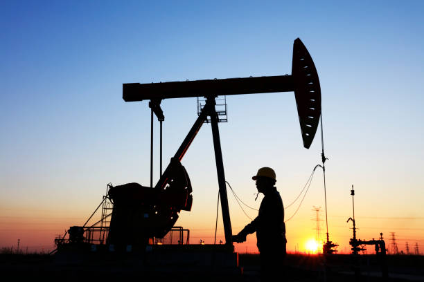 istock oil field, the oil workers are working 1163112263