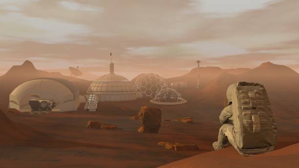 istock 3D rendering. Colony on Mars. Astronaut sitting on Mars and admiring the scenery. Exploring Mission To Mars. Futuristic Colonization and Space Exploration Concept. 1163121568