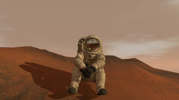istock 3D rendering. Colony on Mars. Astronaut sitting on Mars and admiring the scenery. Exploring Mission To Mars. Futuristic Colonization and Space Exploration Concept. 1163121594