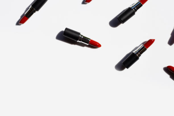 istock Flat lay composition, Lipsticks on white background with shadow. Beautiful Make-up concept 1163121869