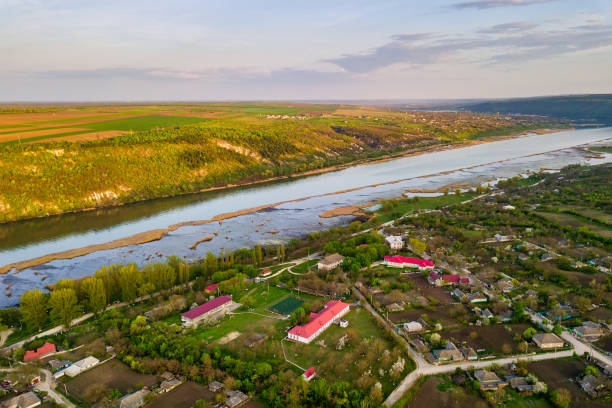 istock Arial view over the river and small village. 1163123208