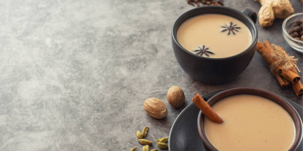 istock Masala tea. Traditional indian chai in black cup with spiced on grey background. With copy space 1163127200